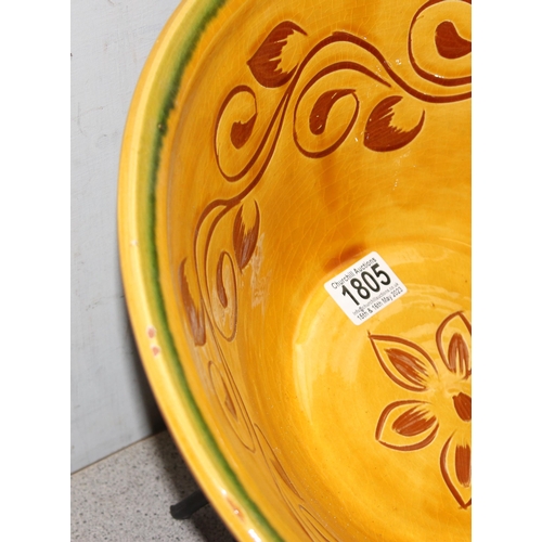 1805 - A large decorative terracotta bowl marked Zafra on iron stand and an indistinctly signed Art Pottery... 