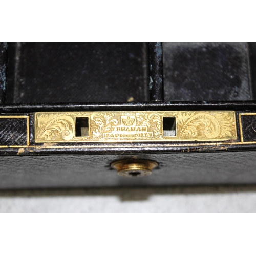 290 - An antique Moroccan leather traveling jewellery box by Brigg of Piccadilly, the box with Bramah lock... 