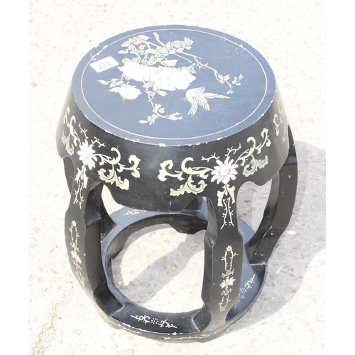 137 - An Oriental lacquer side table or garden seat with carved and coloured design, approx 31cm in diamet... 