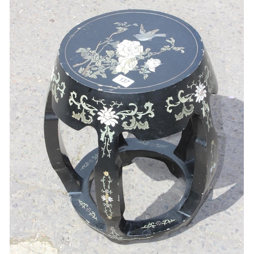 137 - An Oriental lacquer side table or garden seat with carved and coloured design, approx 31cm in diamet... 