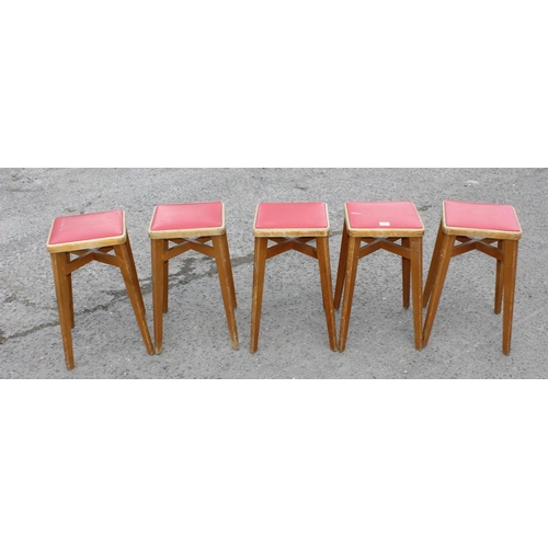 141 - Set of five retro light wood & red seated leatherette stools by Stoe, approx 57cm tall