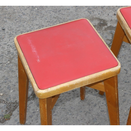 141 - Set of five retro light wood & red seated leatherette stools by Stoe, approx 57cm tall