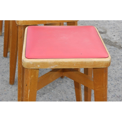 141 - Set of five retro light wood & red seated leatherette stools by Stoe, approx 57cm tall