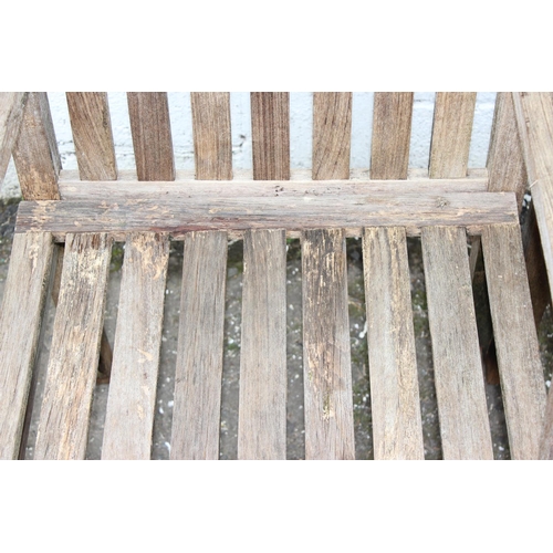 311 - A set of 6 weathered teak garden chairs