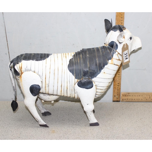 314 - A vintage style metal garden model of a cow, approx 49cm nose to tail