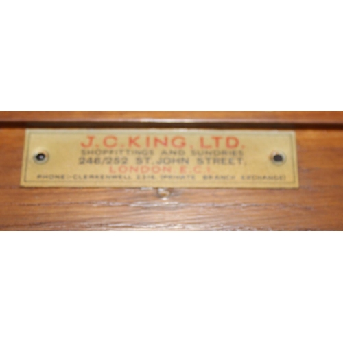 7 - A pair of early 20th Century haberdashery shop fitters display cabinet with plaque for 'J.C. King Lt... 