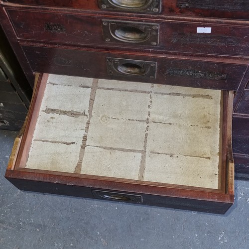 5 - A late Victorian mahogany haberdashery shop bank of fourteen drawers, each graduated drawer with flu... 