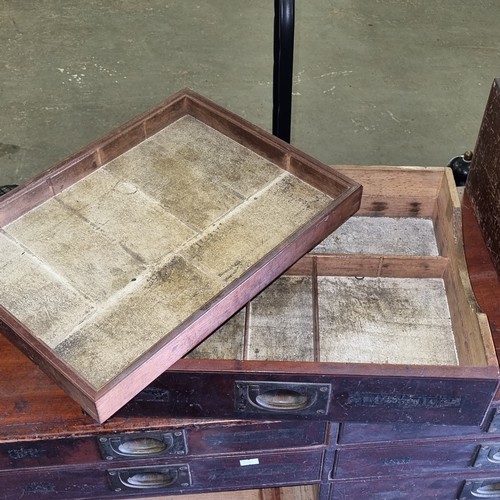 5 - A late Victorian mahogany haberdashery shop bank of fourteen drawers, each graduated drawer with flu... 