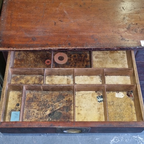 5 - A late Victorian mahogany haberdashery shop bank of fourteen drawers, each graduated drawer with flu... 