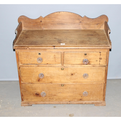 84A - A 19th century Pine 2 over 2 chest of drawers with unusual top rail and glass handles, approx 94cm w... 