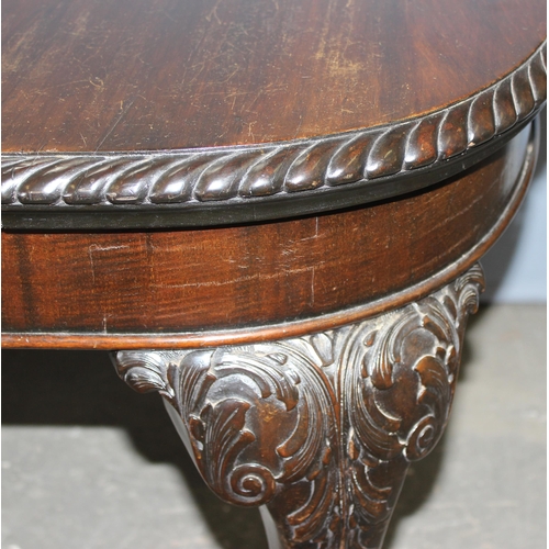 11 - An impressive late 19th or early 20th century mahogany table with extra leaf and original winding ha... 