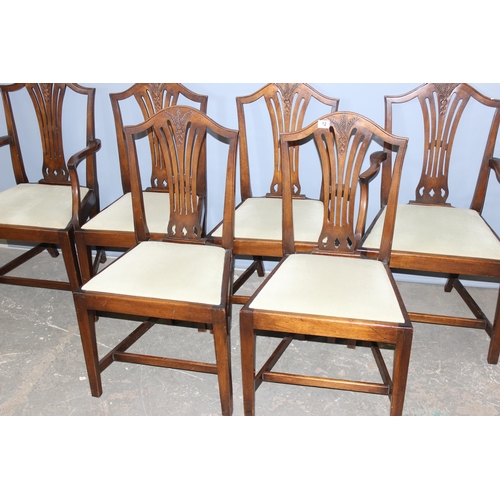 12 - A set of 6 Hepplewhite style dining chairs with carved wheatsheaf motifs