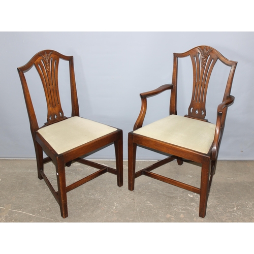 12 - A set of 6 Hepplewhite style dining chairs with carved wheatsheaf motifs