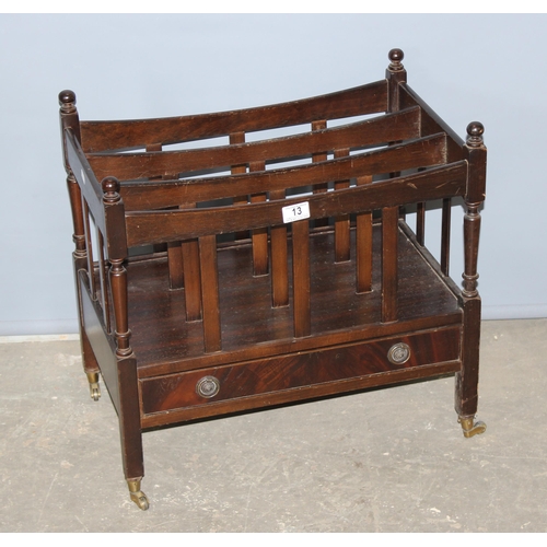 13 - Antique style canterbury magazine rack with single drawer, standing on brass castors, approx 56cm wi... 