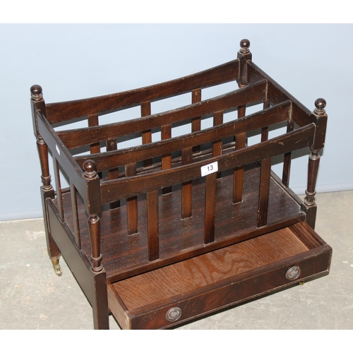 13 - Antique style canterbury magazine rack with single drawer, standing on brass castors, approx 56cm wi... 