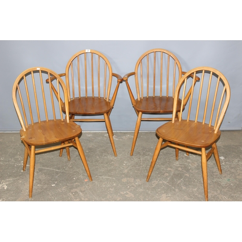 2 - A set of 4 retro blonde Ercol hoop back dining chairs, 1 dining chairs and 3 carvers, one of which h... 