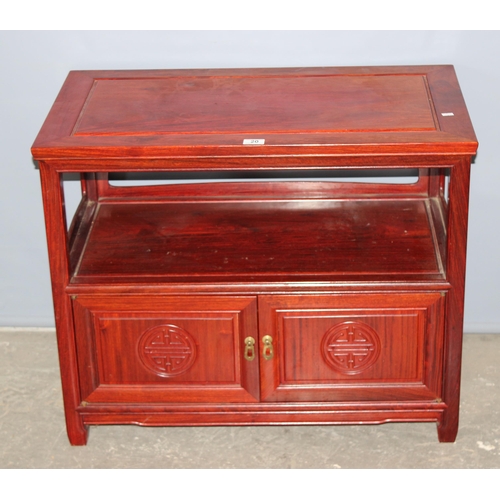 20 - A 20th century Chinese hardwood table with cupboard base, approx 82cm wide