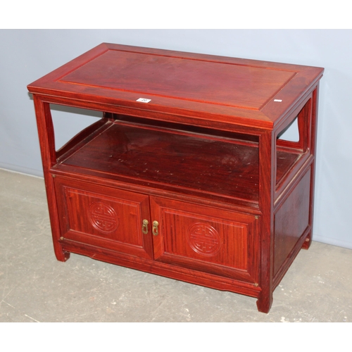 20 - A 20th century Chinese hardwood table with cupboard base, approx 82cm wide