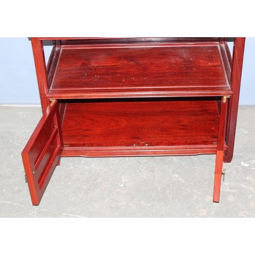 20 - A 20th century Chinese hardwood table with cupboard base, approx 82cm wide