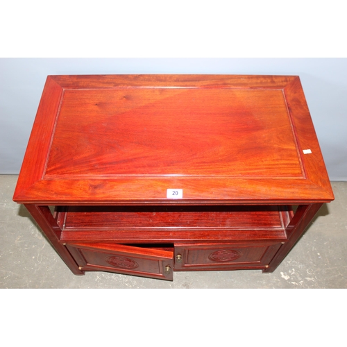 20 - A 20th century Chinese hardwood table with cupboard base, approx 82cm wide