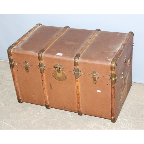 22 - A large vintage canvas and wooden shipping trunk with flat top, approx 79cm wide x 49cm deep x 50cm ... 