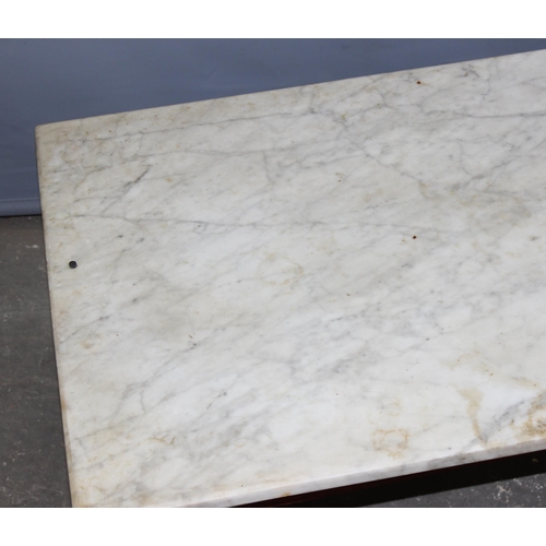 25 - A small marble topped low table, approx 107cm x 51cm