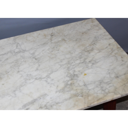 25 - A small marble topped low table, approx 107cm x 51cm