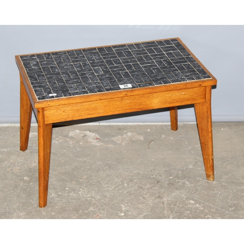 26 - A small retro black tiled topped coffee table, approx 60cm x 38cm