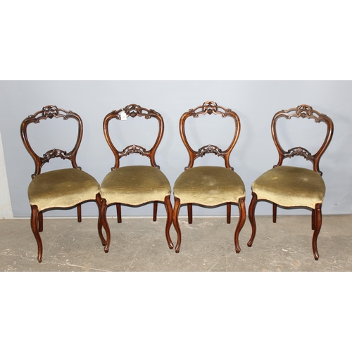 33 - A set of 4 Victorian carved balloon backed dining chairs with upholstered seats