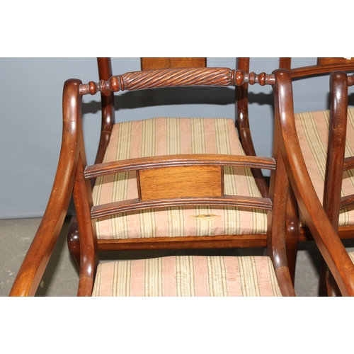 39 - A set of 8 Regency style sabre legged dining chairs with turned rail backs