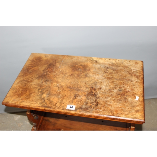 44 - A 19th century walnut side table with single drawer, standing on brass and ceramic castors with carv... 