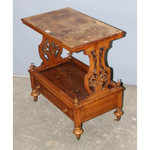 44 - A 19th century walnut side table with single drawer, standing on brass and ceramic castors with carv... 