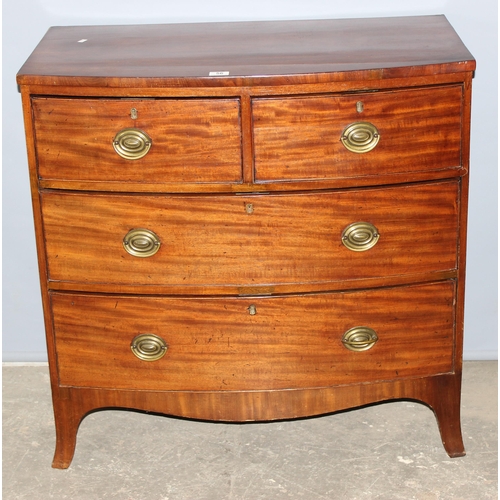 56 - A Georgian mahogany 2 over 2 chest of drawers standing on bracket feet, with round brass handles, ap... 