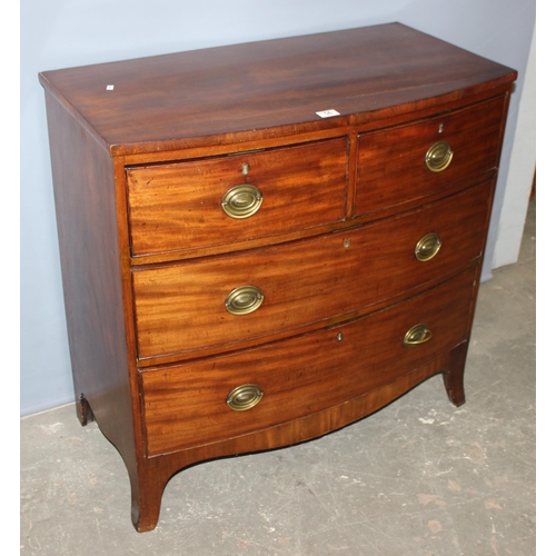 56 - A Georgian mahogany 2 over 2 chest of drawers standing on bracket feet, with round brass handles, ap... 