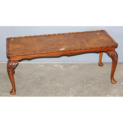 58 - An early 20th century low table with pie crust edge and carved cabriole legs, approx 106cm x 44cm