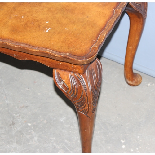 58 - An early 20th century low table with pie crust edge and carved cabriole legs, approx 106cm x 44cm