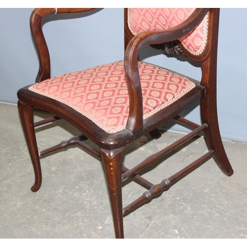 59 - An antique mahogany bedroom chair with carved details and strung inlay, likely Edwardian