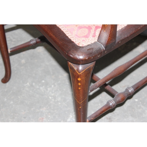 59 - An antique mahogany bedroom chair with carved details and strung inlay, likely Edwardian