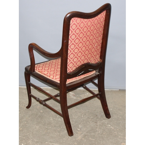 59 - An antique mahogany bedroom chair with carved details and strung inlay, likely Edwardian