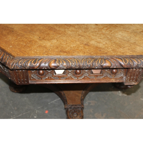 64 - An extremely impressive late 19th century Victorian oak Gothic Revival, octagonal library table, wit... 