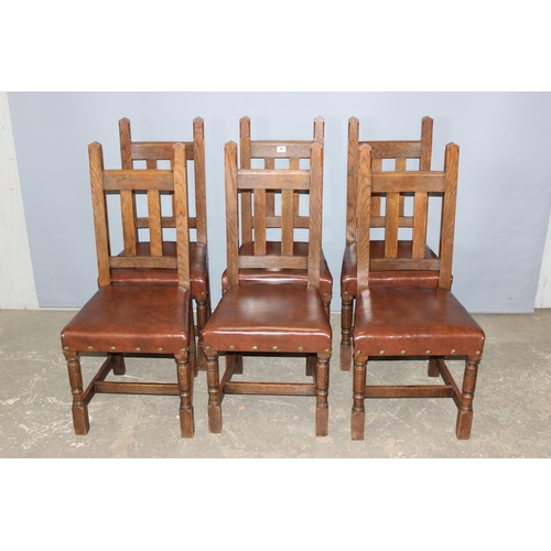 66 - A set of 6 Arts & Crafts period oak dining chairs with studded leather or leatherette seats