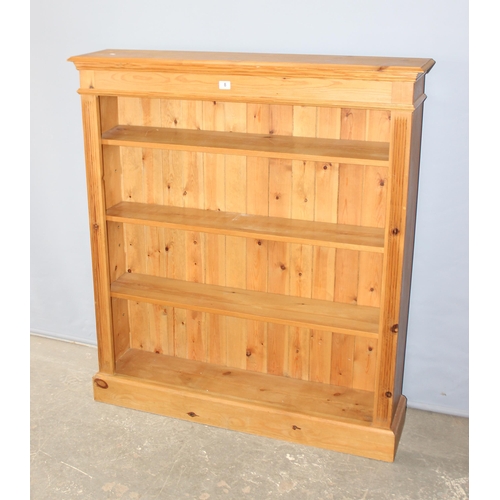 8 - Modern pine bookcase with 3 adjustable shelves, approx 122cm wide