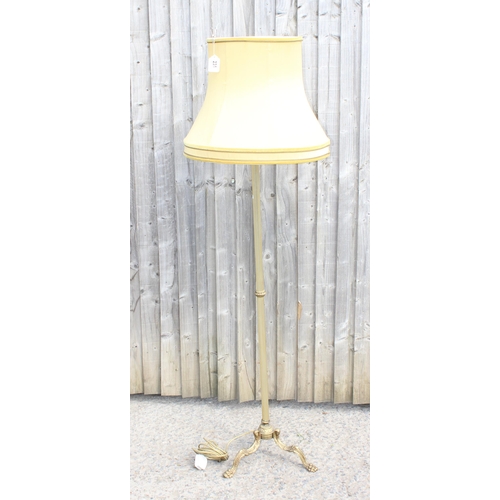 231 - A vintage gilt metal or brass standard lamp with shade, approx 162cm tall