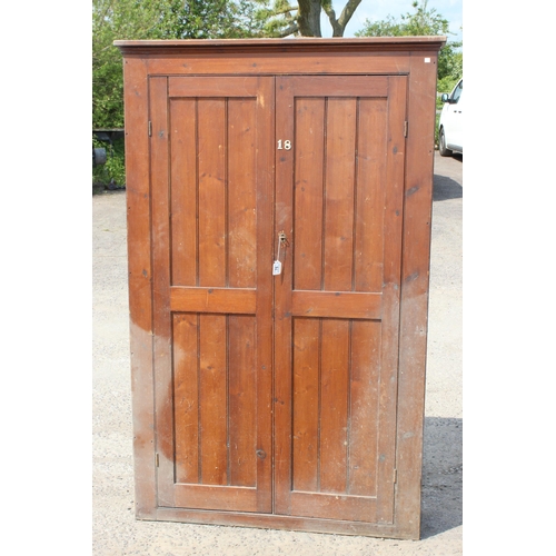 75 - A vintage stained pine hall cupboard with doors, likely early 20th century, approx 122cm wide x 192c... 