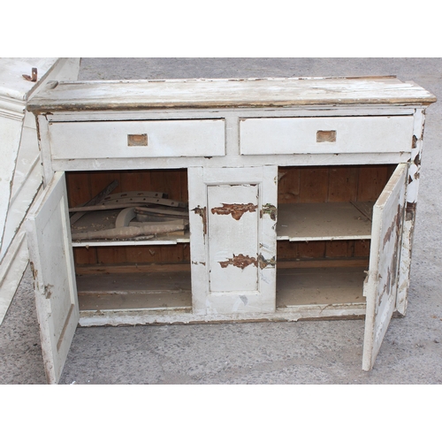 82 - A large Victorian painted pine dresser with 2 drawers over 2 cupboards under a 2 tier plate rack, ap... 