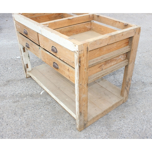 83 - A vintage pine butchers block table base with 4 cup handled drawers, lacking top, approx 122cm wide ... 