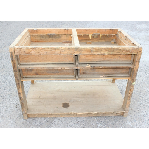 83 - A vintage pine butchers block table base with 4 cup handled drawers, lacking top, approx 122cm wide ... 