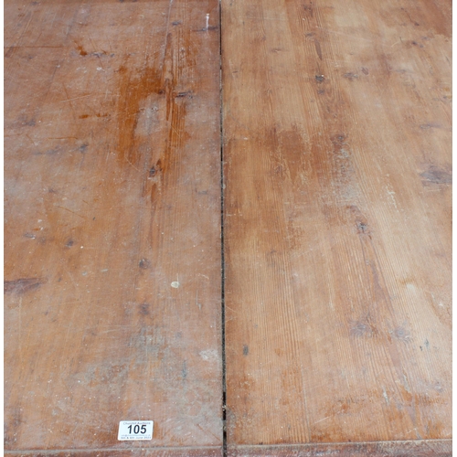 105 - A large antique dining table with pine top and mahogany base, approx 150cm x 130cm