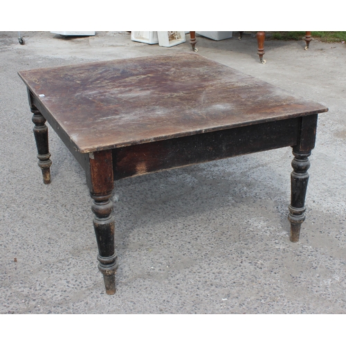 106 - A large antique dining table with painted pine base and mahogany top, approx 153cm x 122cm