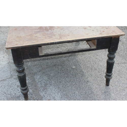 106 - A large antique dining table with painted pine base and mahogany top, approx 153cm x 122cm